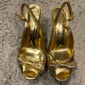 BCBGirls gold/multi-color heels.